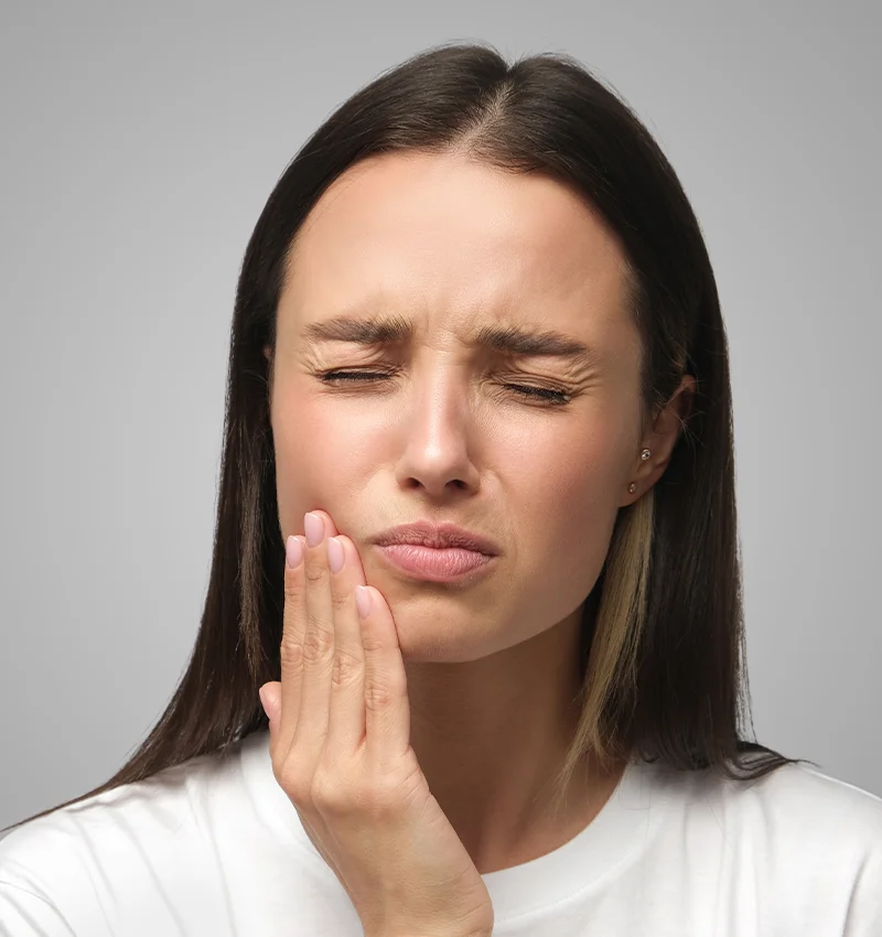 A woman with a toothache on her face.